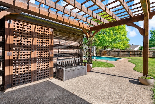 view of patio / terrace featuring a pergola and a fenced in pool