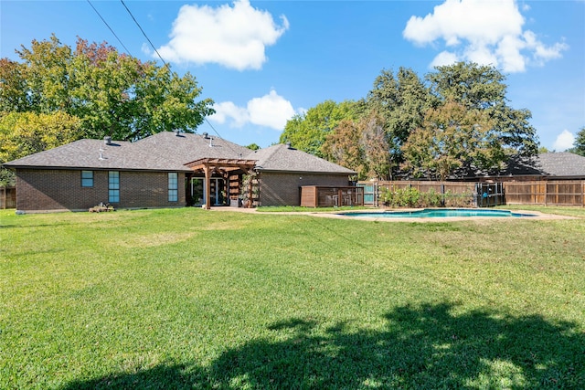 view of yard featuring a pergola and a fenced in pool