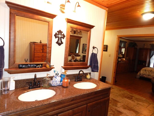 bathroom with vanity and wooden ceiling