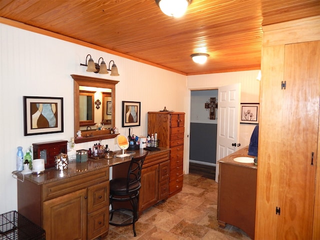 interior space with vanity and wood ceiling