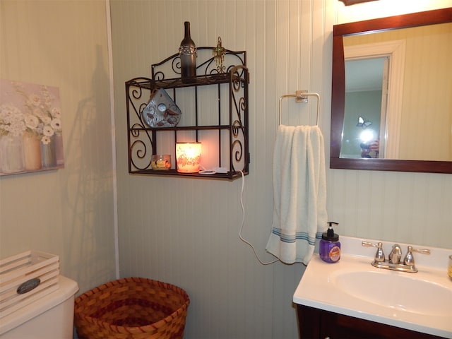 bathroom featuring vanity and toilet