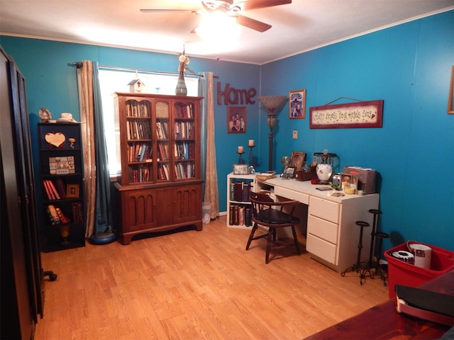 office space featuring ornamental molding, light hardwood / wood-style floors, and ceiling fan