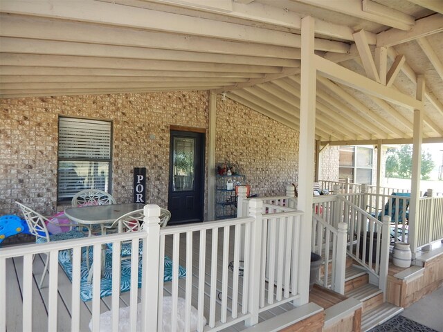 property entrance with covered porch