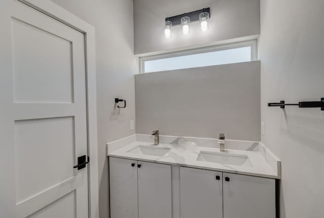 bathroom featuring a wealth of natural light and vanity