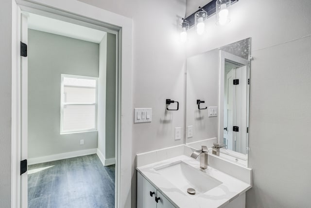 bathroom featuring wood-type flooring and vanity