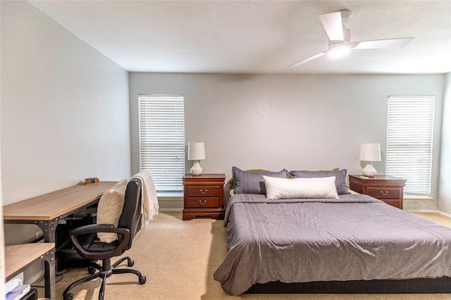 bedroom featuring ceiling fan and light carpet