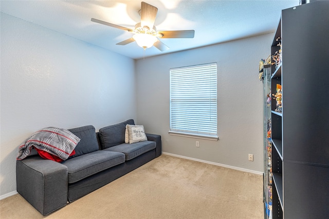 living room featuring ceiling fan and light carpet