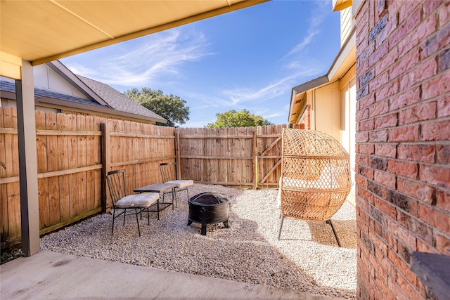 view of patio / terrace featuring a fire pit