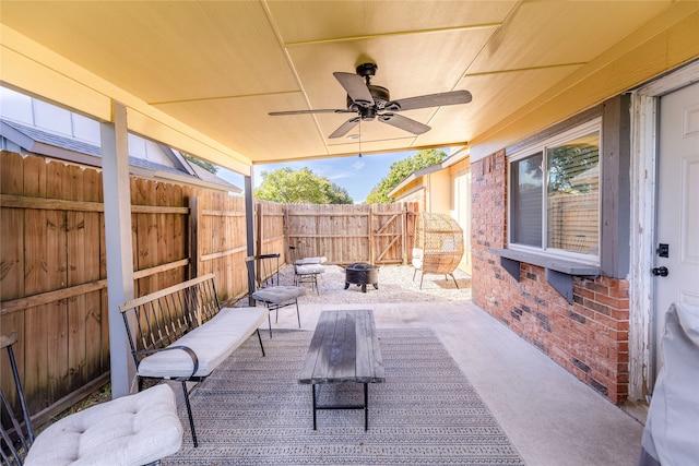 view of patio / terrace featuring a fire pit and ceiling fan