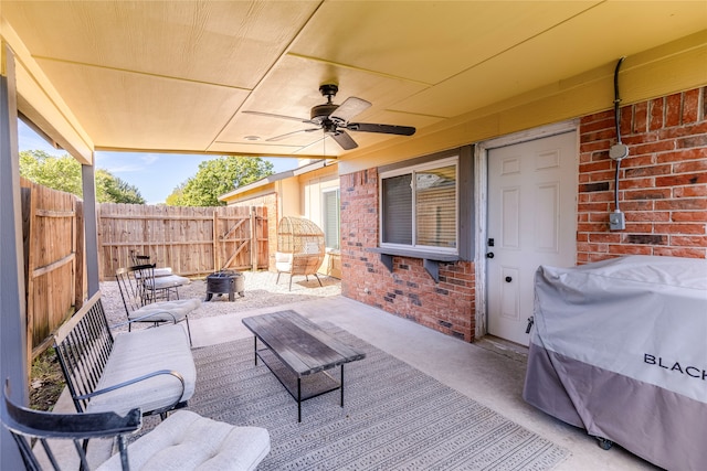 view of patio featuring a fire pit and ceiling fan