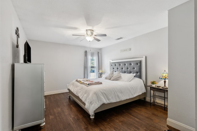 bedroom featuring ceiling fan and dark hardwood / wood-style floors