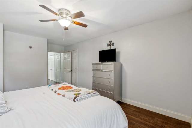 bedroom with ceiling fan and dark hardwood / wood-style flooring