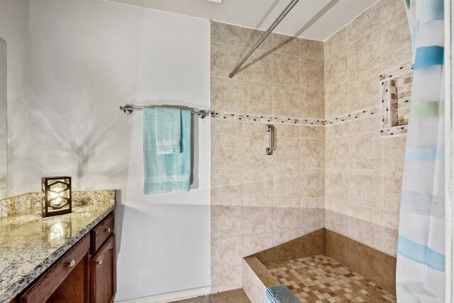 bathroom with vanity and a shower with shower curtain