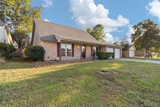 view of front of property featuring a garage and a front yard