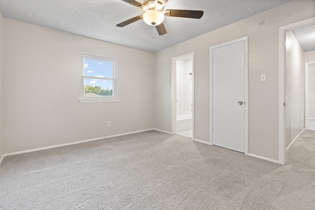 unfurnished bedroom with ceiling fan, a textured ceiling, and light colored carpet