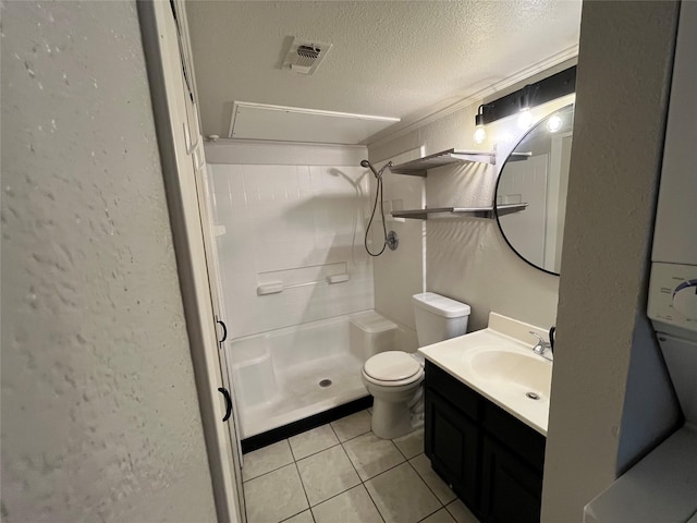 bathroom featuring visible vents, a shower stall, a textured ceiling, tile patterned floors, and toilet