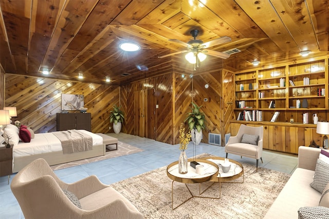 living area with wood ceiling, built in shelves, ceiling fan, wooden walls, and light tile patterned floors