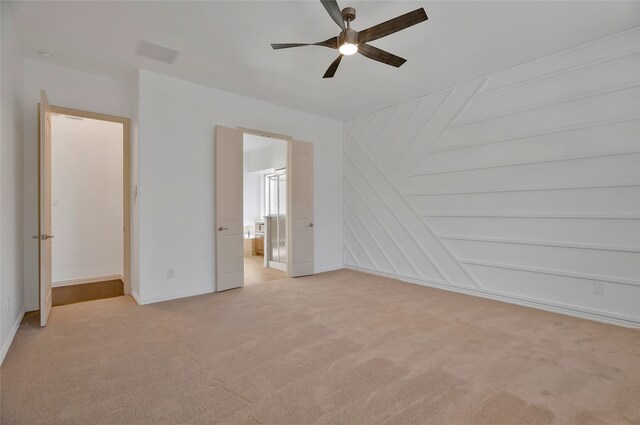 unfurnished bedroom featuring ceiling fan and light colored carpet