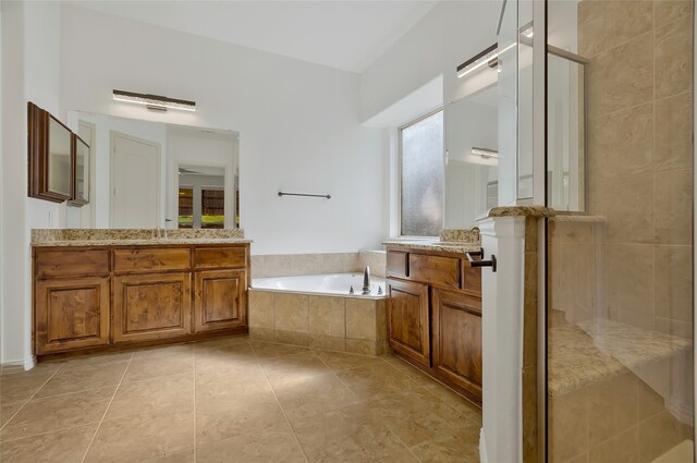 bathroom with vanity, plus walk in shower, and tile patterned flooring