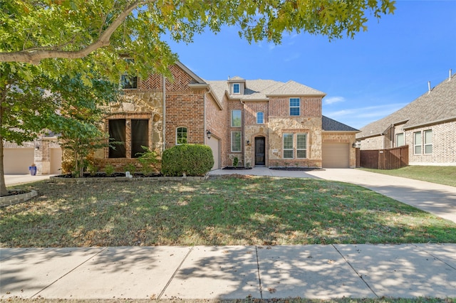 13647 Monstrell Rd, Frisco, TX 75035 - view of front of house featuring a garage, driveway, brick siding, and stone siding