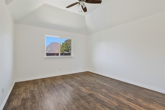 spare room featuring dark wood-type flooring, lofted ceiling, and ceiling fan