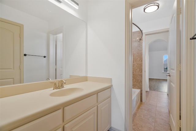 bathroom with shower / bathing tub combination, vanity, and tile patterned floors