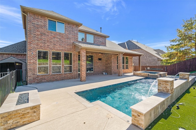 view of swimming pool featuring a patio, an in ground hot tub, and pool water feature