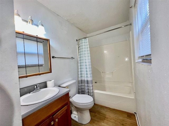 full bathroom featuring vanity, hardwood / wood-style floors, shower / bath combination with curtain, and toilet