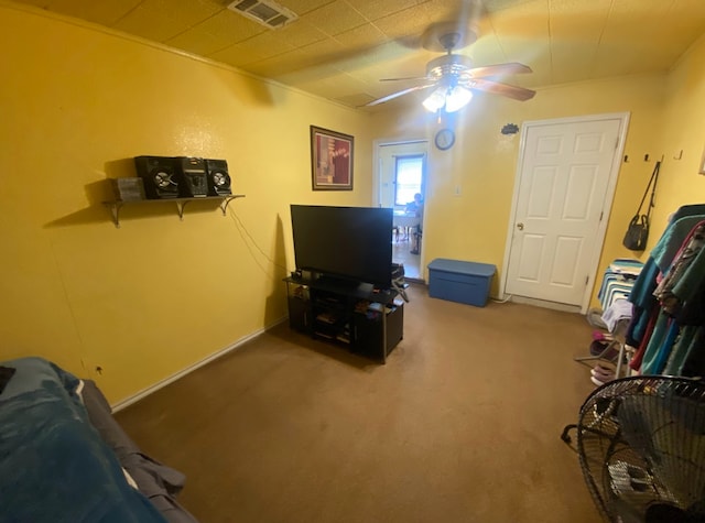 interior space with ceiling fan and carpet floors