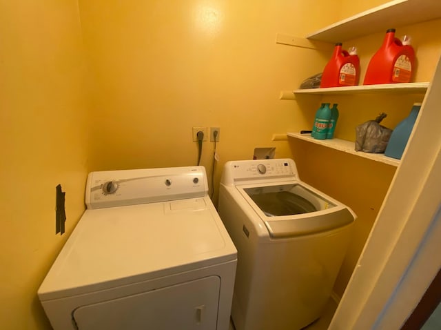 laundry area with washing machine and dryer