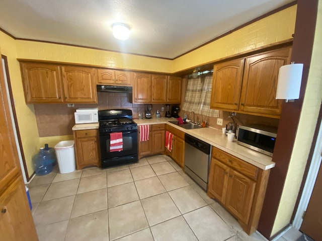 kitchen featuring stainless steel appliances, sink, crown molding, and light tile patterned floors