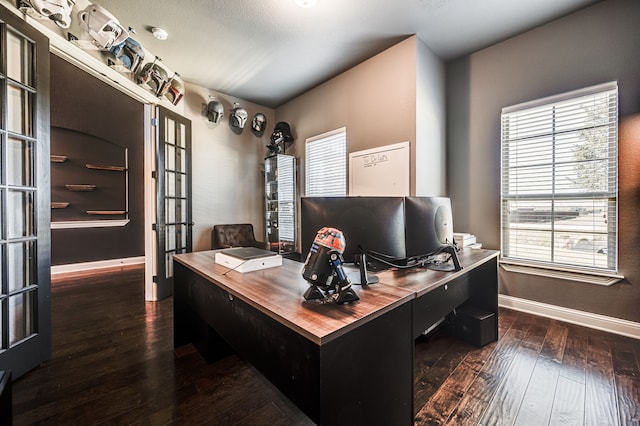 home office featuring french doors and dark hardwood / wood-style flooring