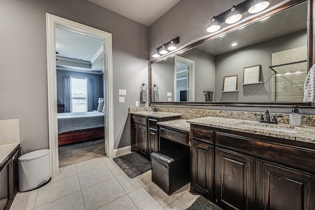 bathroom featuring vanity, tile patterned floors, and a shower