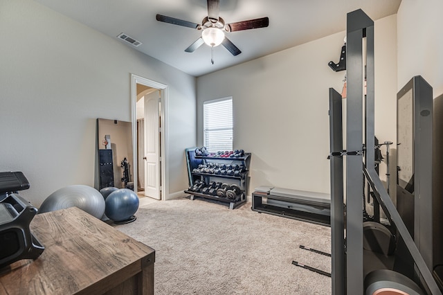 workout area with carpet and ceiling fan