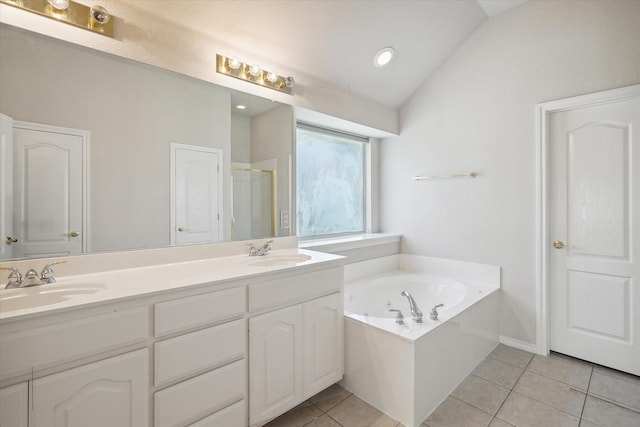 4301 Stonecrest Ct, Fort Worth, TX 76244 - bathroom featuring tile patterned flooring, a garden tub, double vanity, a shower stall, and vaulted ceiling