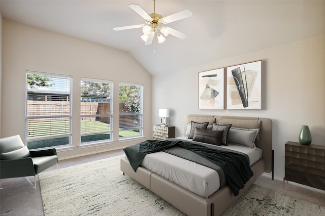 carpeted bedroom with lofted ceiling and ceiling fan