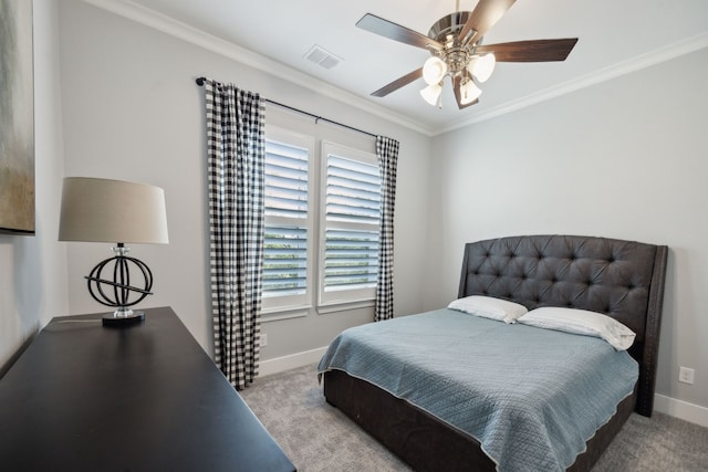 bedroom featuring ceiling fan, crown molding, and light colored carpet