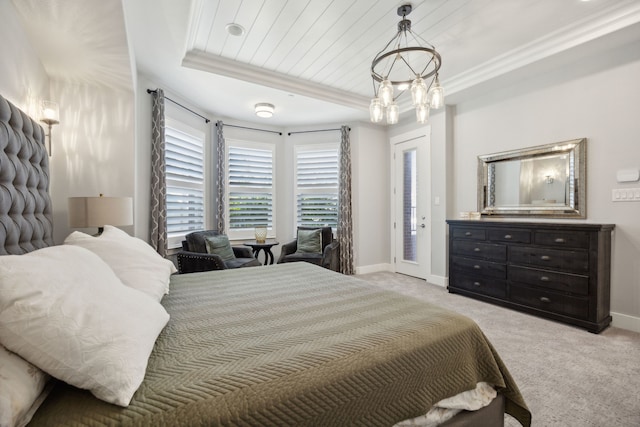 bedroom with wooden ceiling, light carpet, a tray ceiling, crown molding, and access to outside