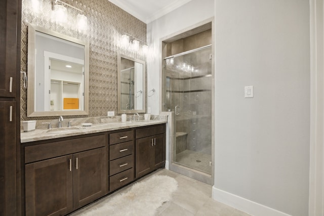 bathroom featuring walk in shower, tile patterned flooring, vanity, and crown molding