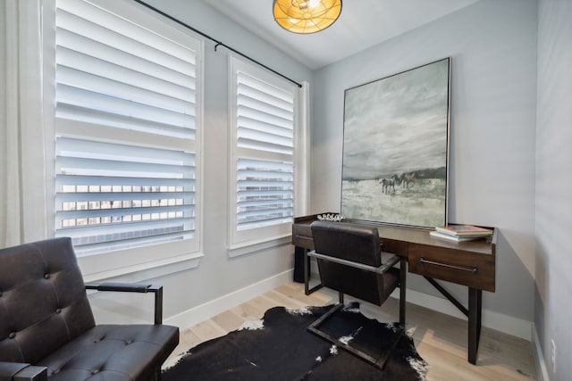 office with light hardwood / wood-style flooring