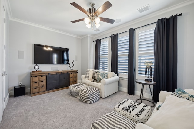 carpeted living room with ceiling fan and crown molding