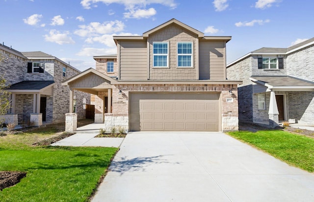 view of front of property with a garage and a front lawn