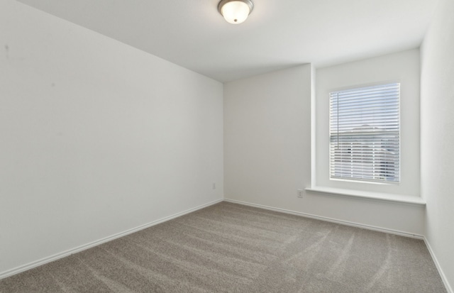 unfurnished room featuring carpet floors