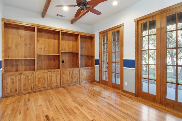 unfurnished living room with ceiling fan, french doors, vaulted ceiling with beams, and light hardwood / wood-style flooring