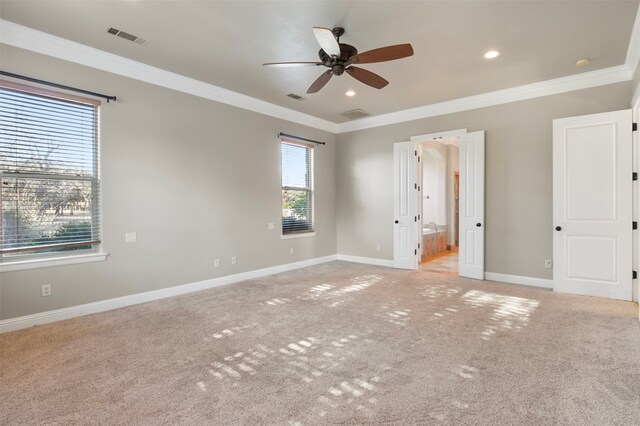 unfurnished bedroom with light colored carpet, ensuite bathroom, ceiling fan, and ornamental molding