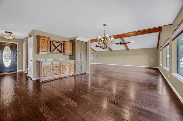 interior space featuring ceiling fan with notable chandelier, vaulted ceiling with beams, and dark hardwood / wood-style flooring