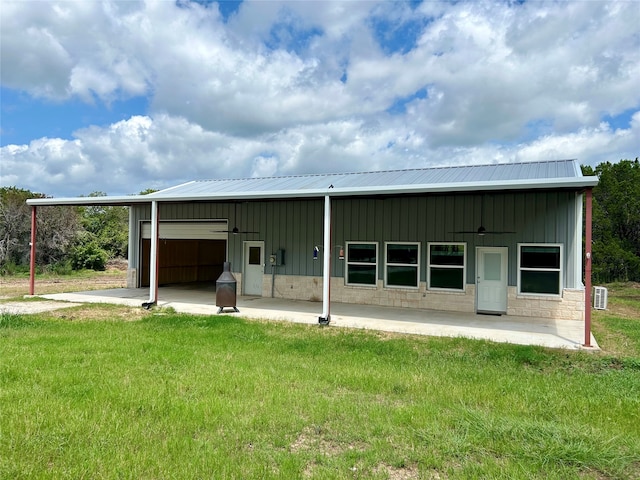 back of house with a yard