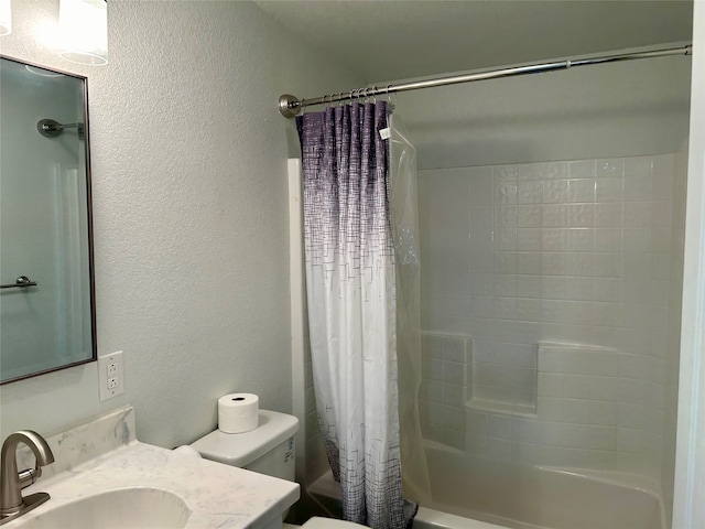 full bathroom with vanity, shower / bath combo with shower curtain, and toilet