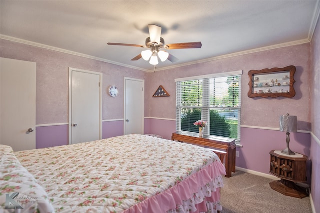 bedroom featuring ceiling fan, crown molding, and carpet floors