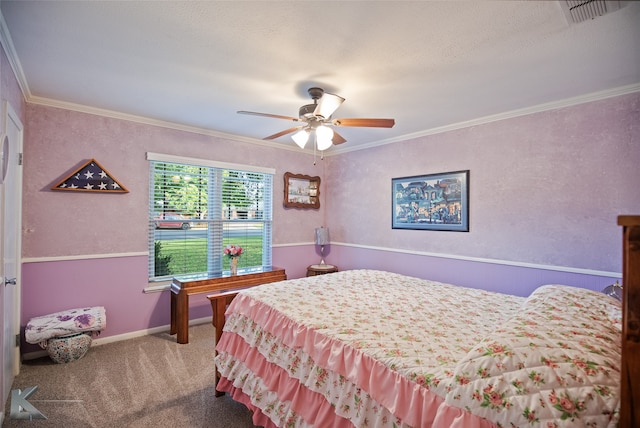 carpeted bedroom featuring ceiling fan, a textured ceiling, and ornamental molding